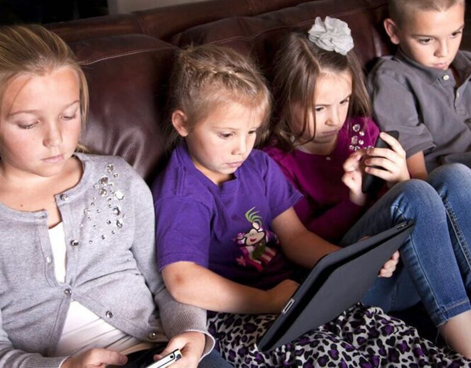 Four kids spending too much screen time on their devices